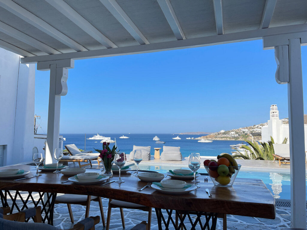 Lunch table outside of Mykonos luxurious villa for booking.