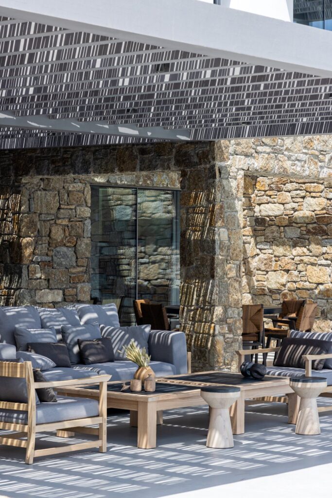 Cozy up on the outdoor sofa in the most lavish Mykonos villa for rent.