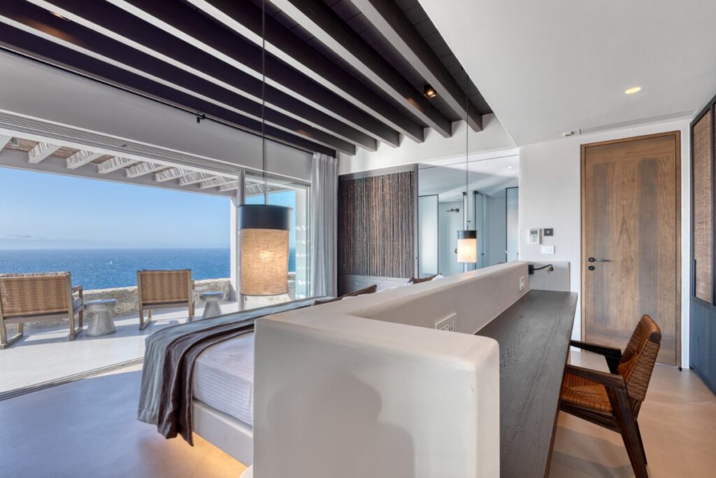 An unobstructed sea view from an ultra-modern bedroom in Mykonos villa for rent.
