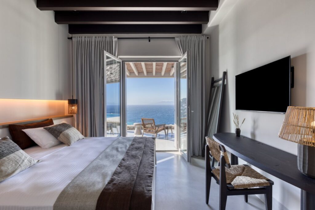 Breathtaking sunrises and sunsets over the sea in the luxurious bedroom of Mykonos villa for rent.