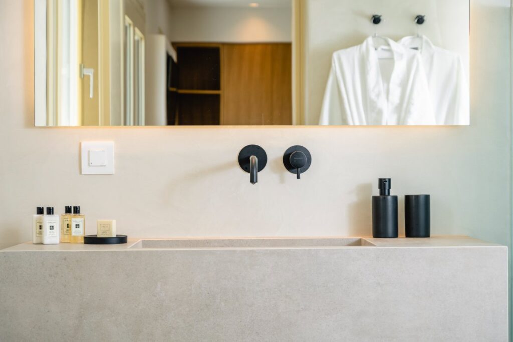 Stylish and modern bathroom, a perfect spot for relaxing in Mykonos' lavish rental villa.