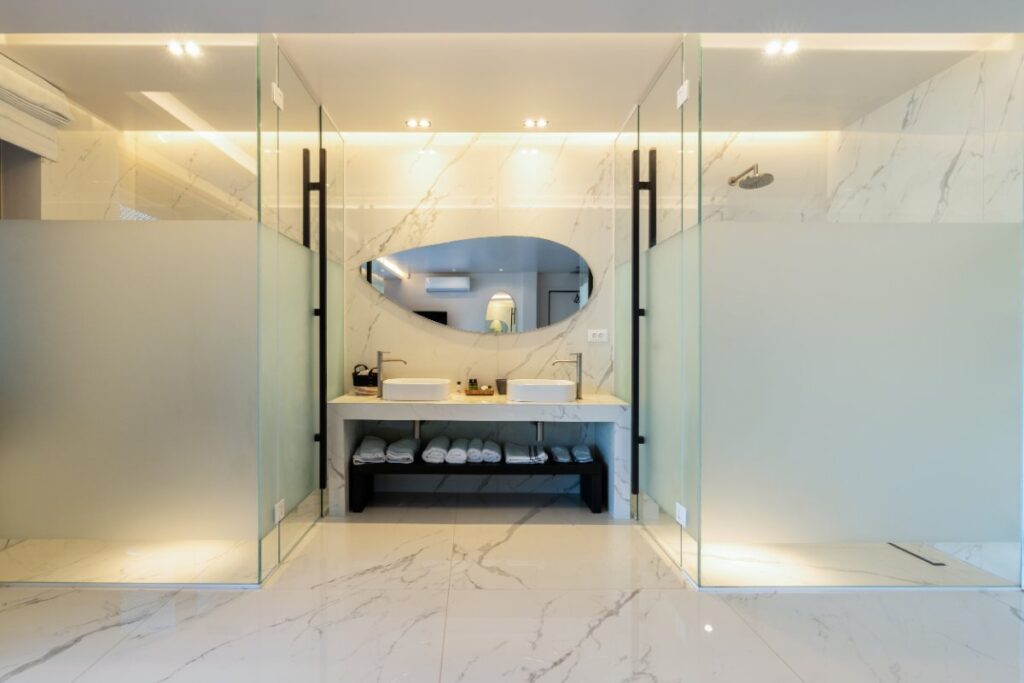 Bathroom amenities, large shower, and modern design in Mykonos secluded rental villa.
