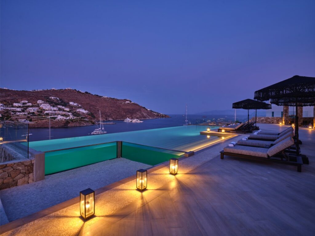 Infinity pool, beautiful sea view, and romantic lights. Mykonos private vacation home for rent.