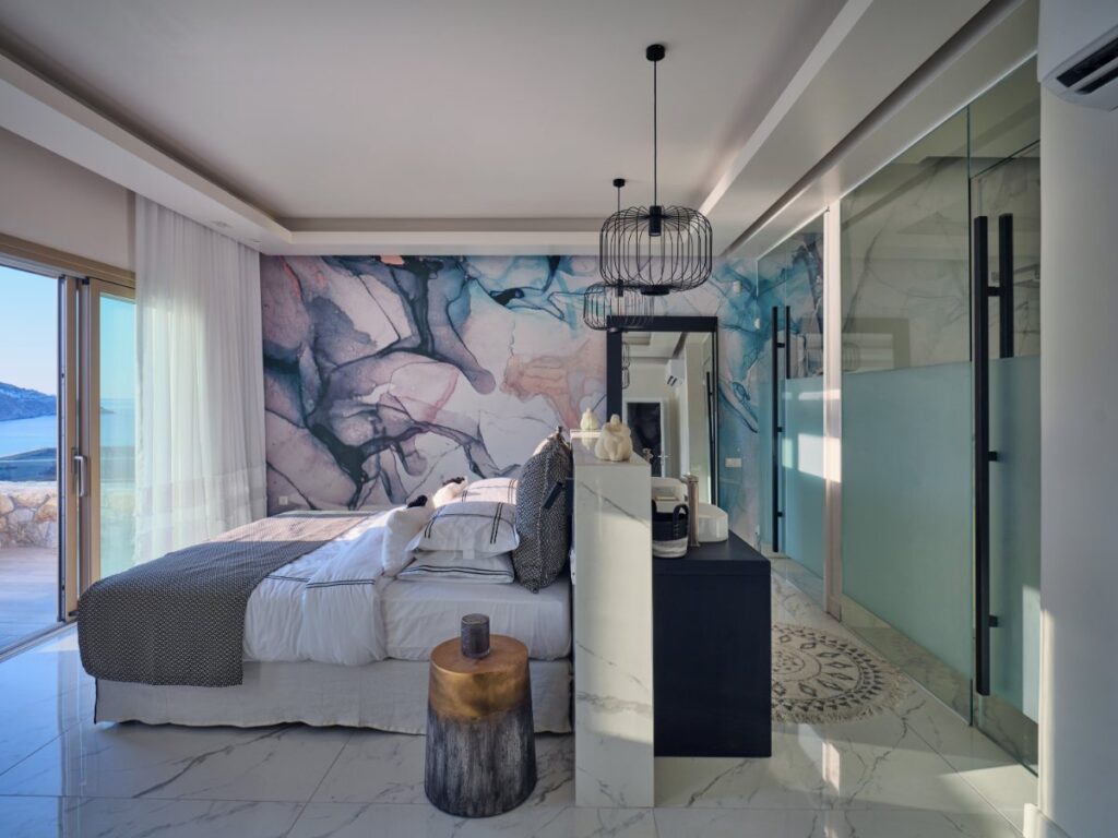 Luxurious bedroom featuring top-of-the-line amenities and comfy bedding, Mykonos villa for rent.