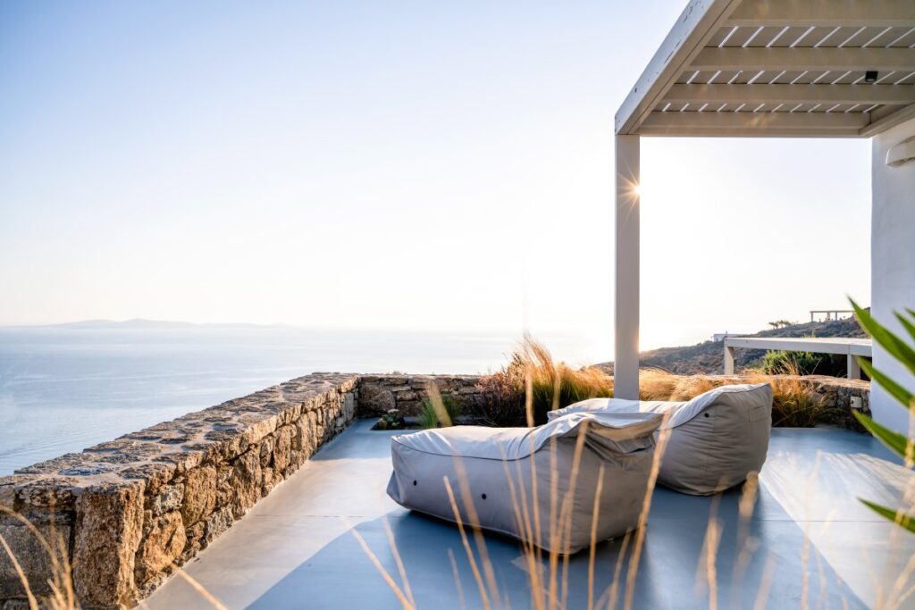 Cozy lazy bags on the terrace with a sea view in Mykonos finest rental villa.
