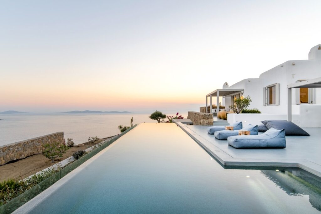 Infinity pool and stunning sunset from Mykonos holiday villa.