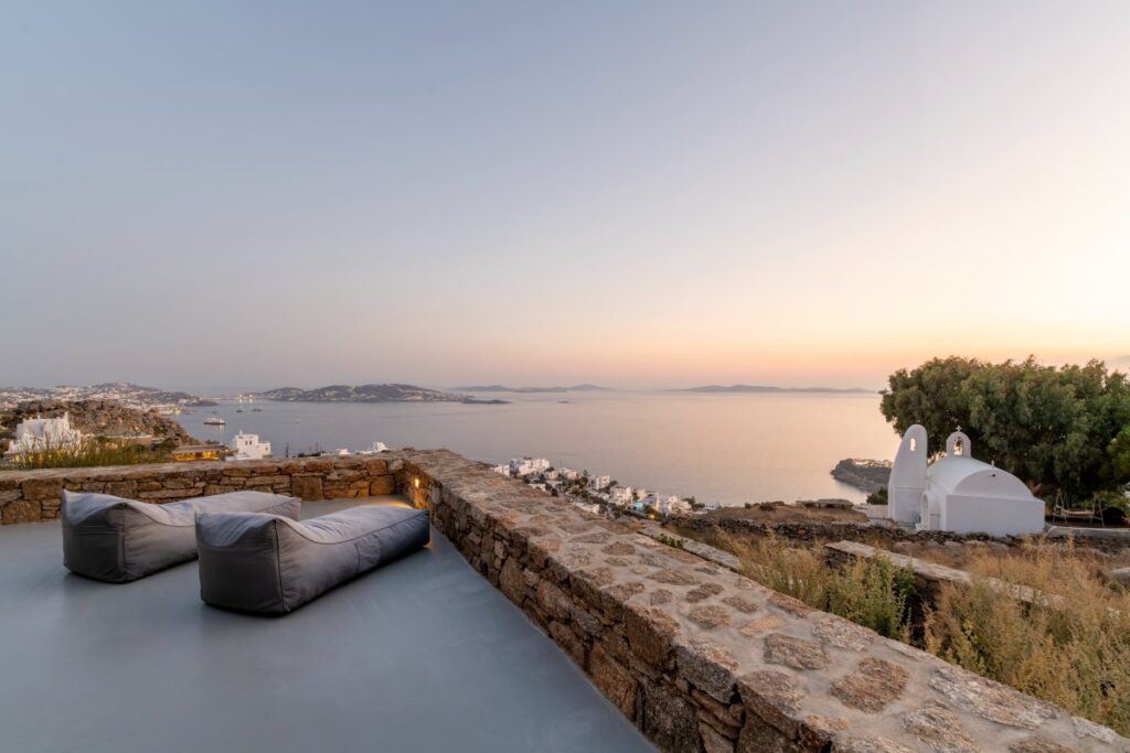 Enjoy the terrace with a mesmerizing sunset view from the Mykonos holiday rental villa.