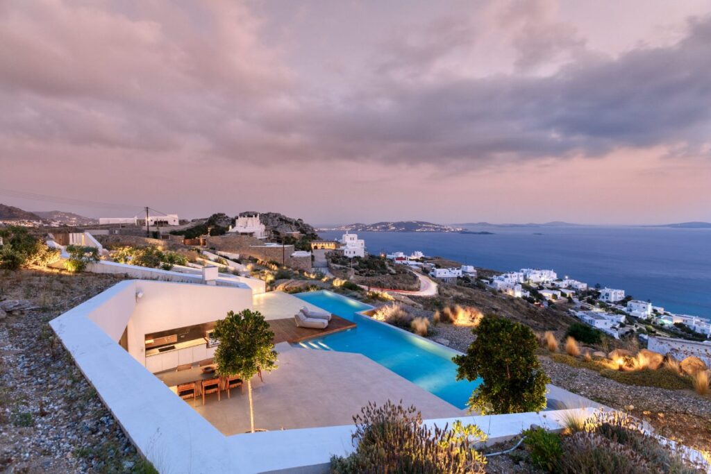 Stunning view of the Aegean Sea, adjustable lights, and outdoor space of the best Mykonos rental villa.