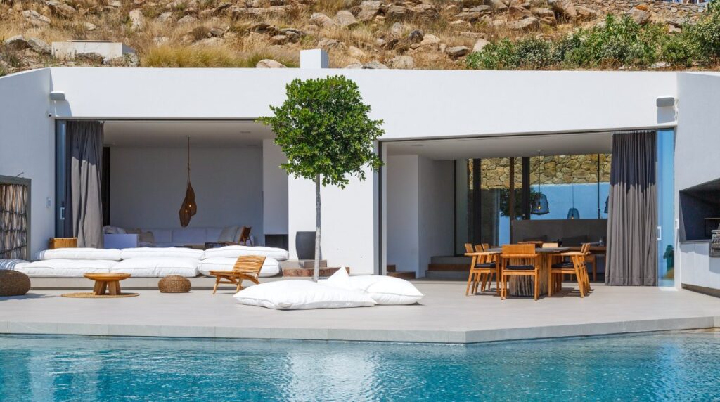 Opulent swimming pool, comfortable floor cushions and table to dine out at, Mykonos secluded villa.
