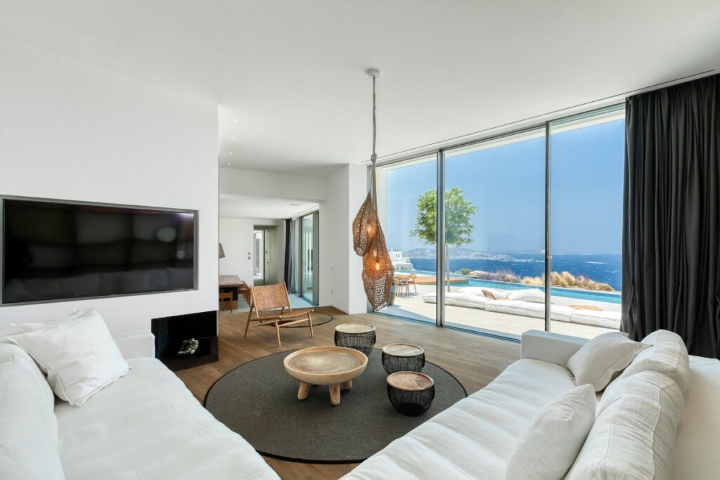 Inviting indoor space with stunning sea view. Luxurious furniture in a splendid Mykonos rental villa.