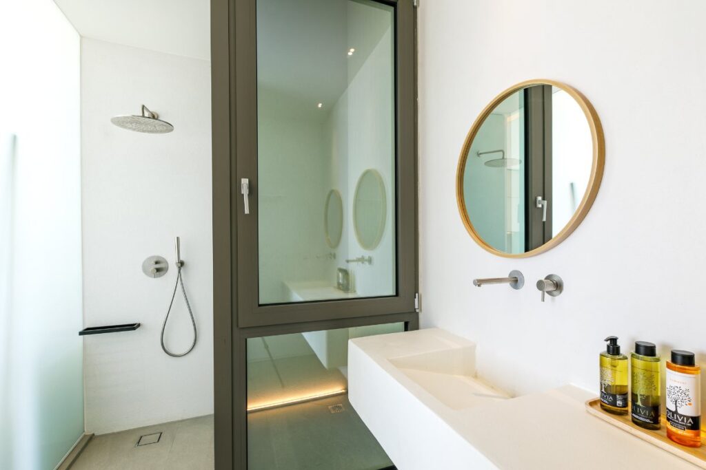 Relaxing and calming design in bathroom in luxurious Mykonos villa for rent.