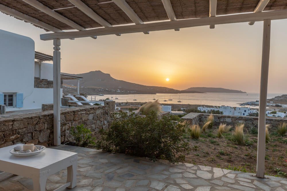 Breathtaking sunset and the seaside view from the spacious terrace at a rental villa in Mykonos.