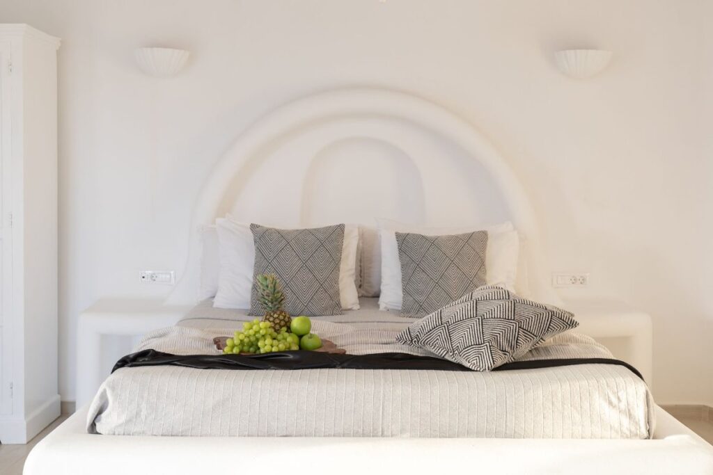 An amazing, peaceful bedroom for relaxing with a comfortable bed in Mykonos private villa for rent.