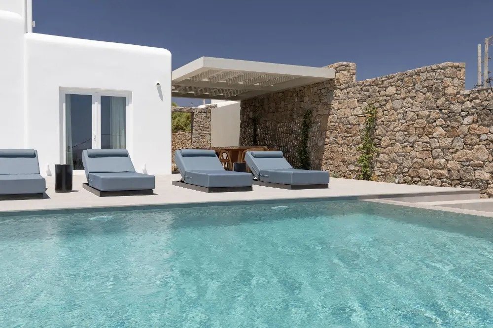 Crystal clear water in a luxurious private swimming pool in Mykonos luxury villa for booking