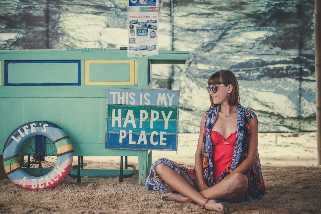 Girl sitting on a sand