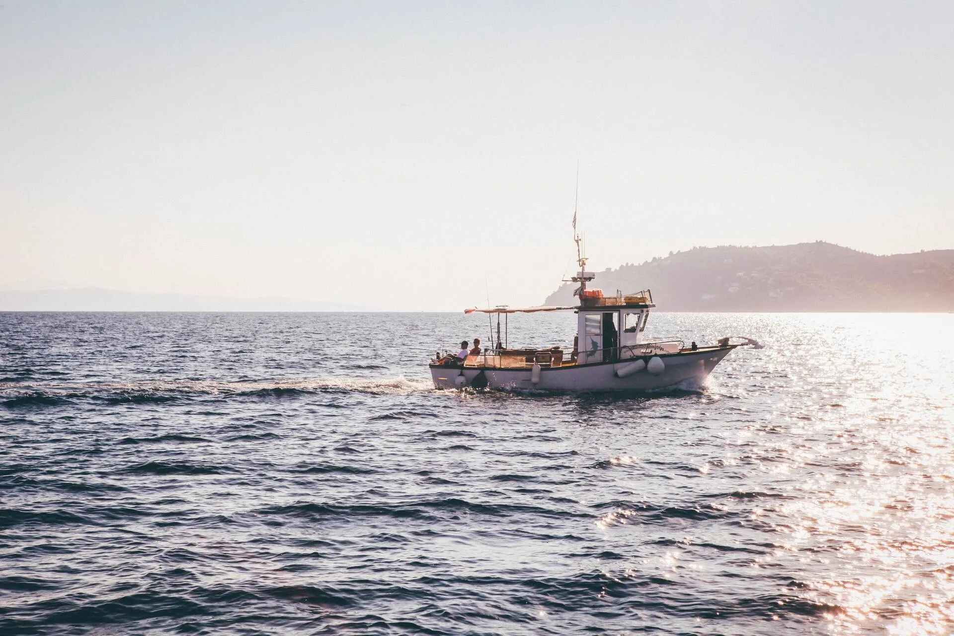 Men fishing on a boat in the sea