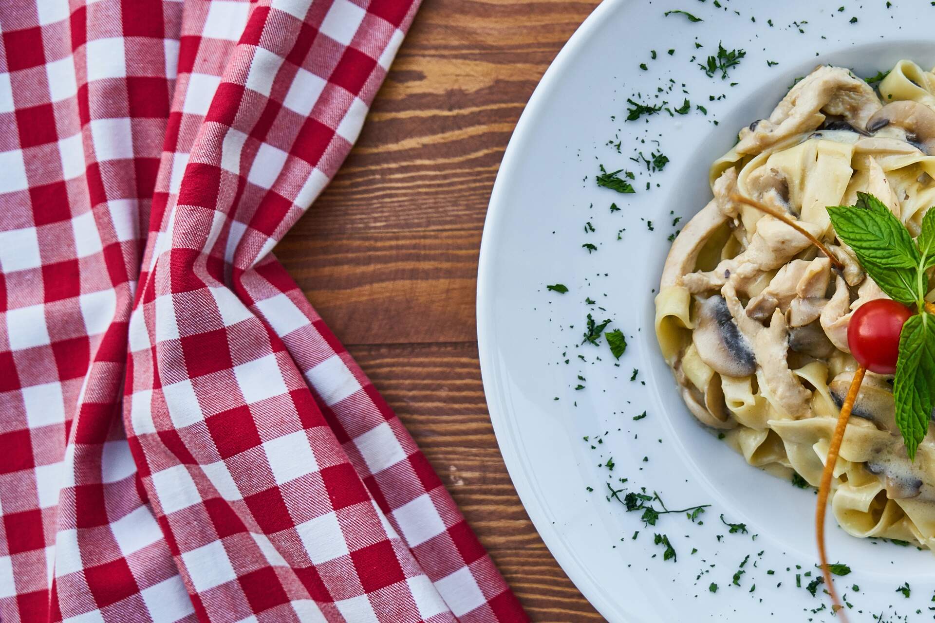 Pasta with a cherry tomato on a plate