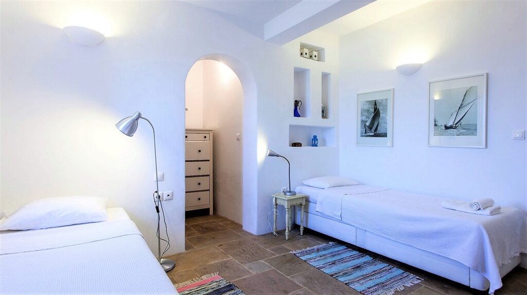 White walls, comfortable beds, and modern design in the best Mykonos villa for rent.