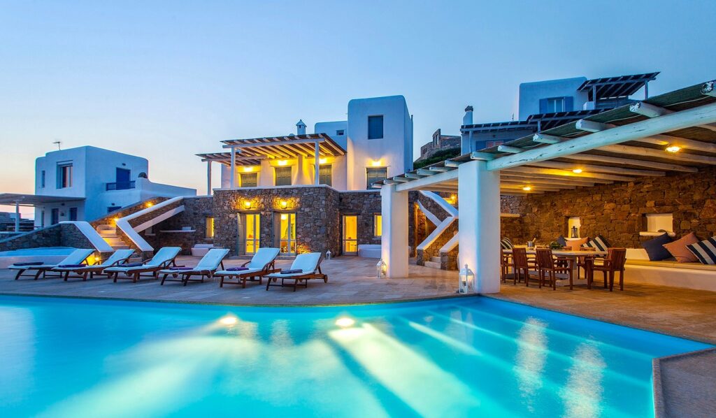 Infinity pool and a cozy terrace in the best luxurious villa for rent, Mykonos, Greece.