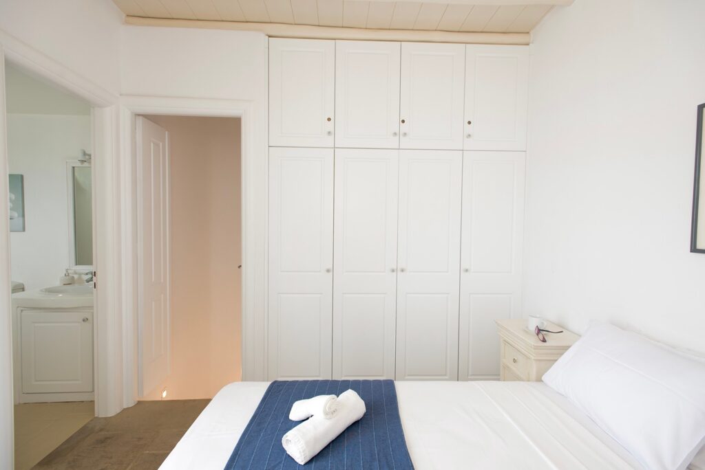 Spacious wardrobe and comfortable bed in the best villa to stay in, Mykonos.