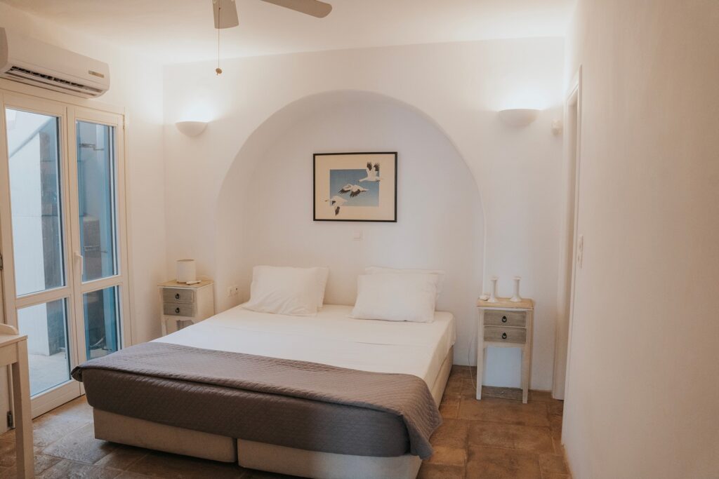 Comfy bedroom in a top rental vacation home, Mykonos, Greece.