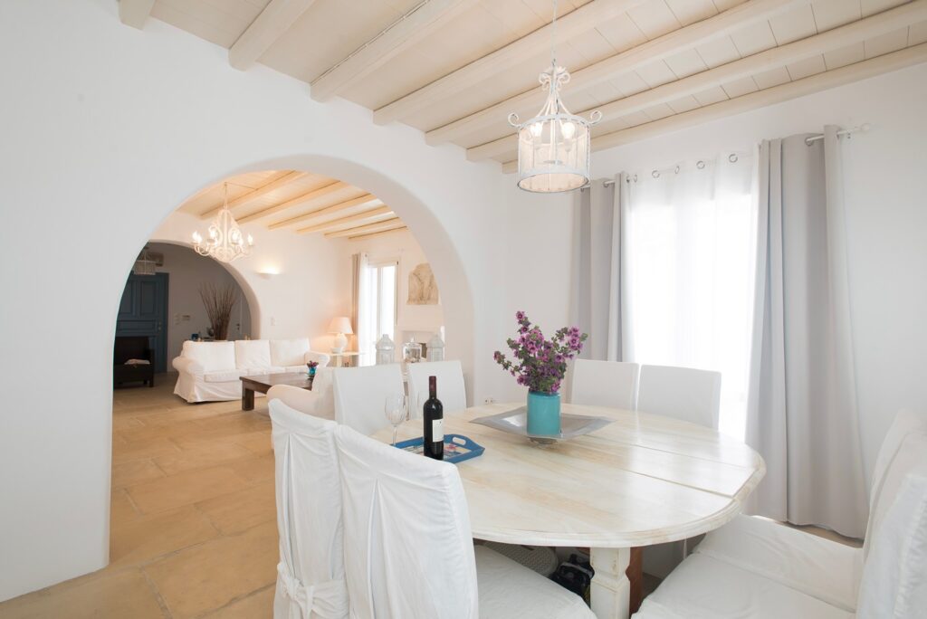 Dining room full of light in a lavish villa for rent, Mykonos.