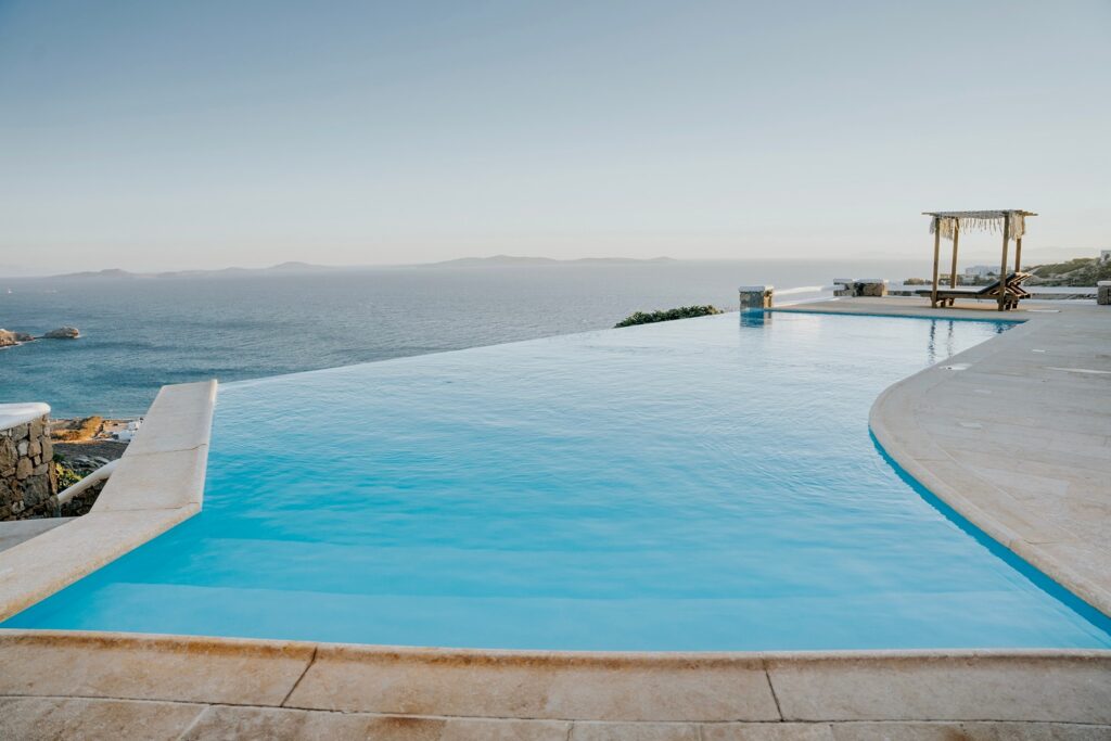 Private infinity pool with a beautiful sea view spot in a luxurious home for rent, Mykonos.