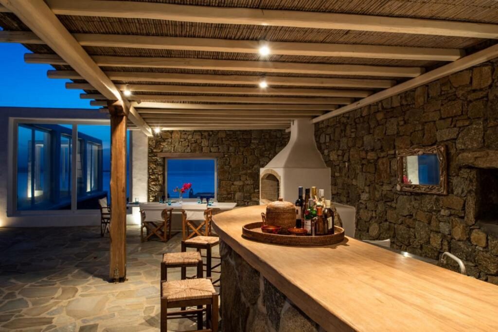 Fancy bar with drinks outside of a lavish villa ready for rent, Mykonos.