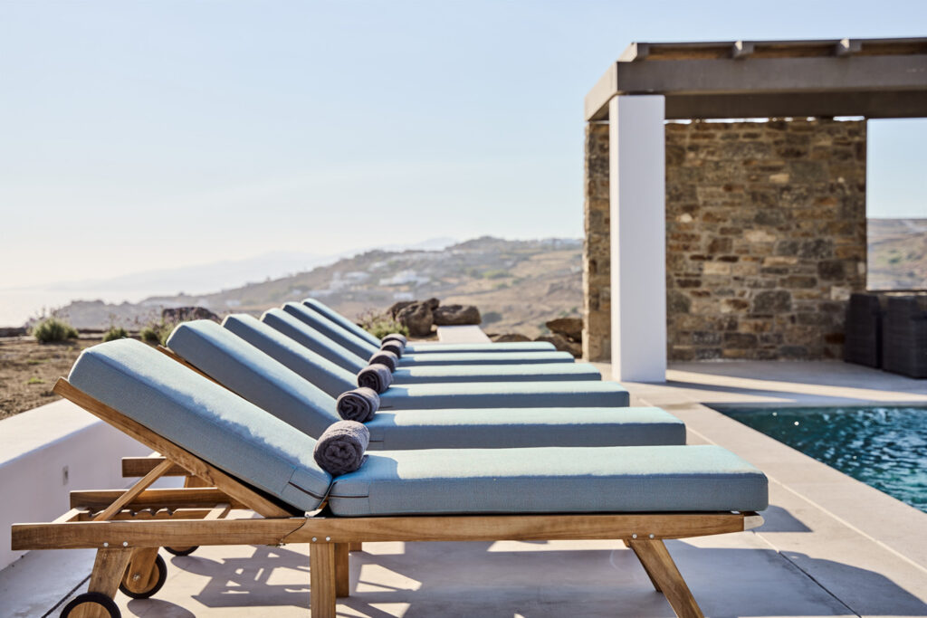 Sun beds are ready for you to enjoy in Mykonos' best rental villa.