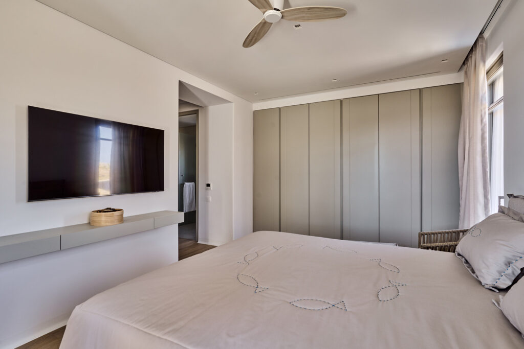 Cozy bed and a huge wardrobe in a splendid home for booking, Mykonos.