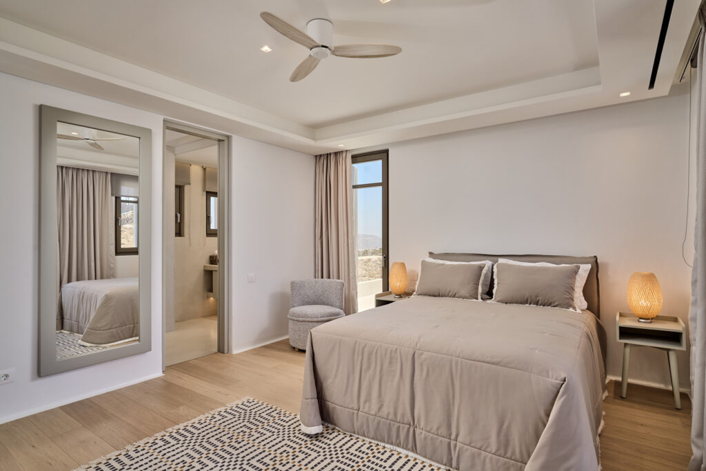 Sophisticated design in a deluxe bedroom, Mykonos lavish villa for rent.