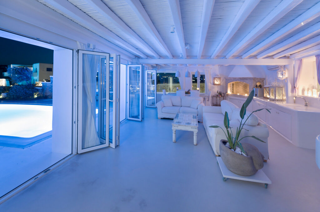 Top luxurious experience in the large living room by the night in Mykonos home for rent.