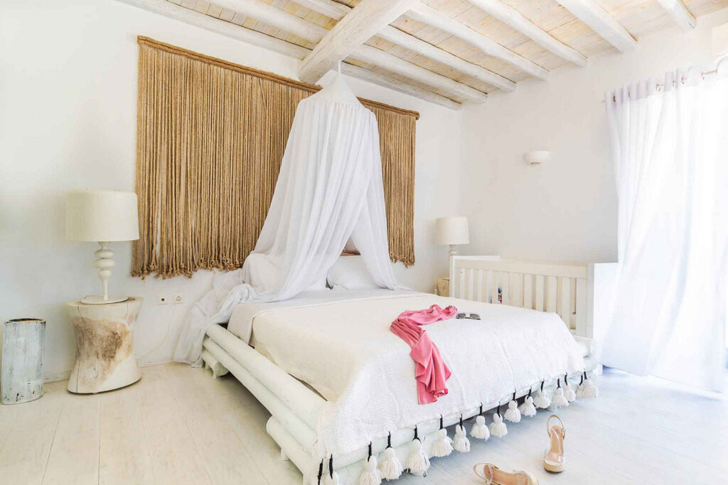 Comfortable bed in a super luxurious bedroom in Mykonos' rental villa.