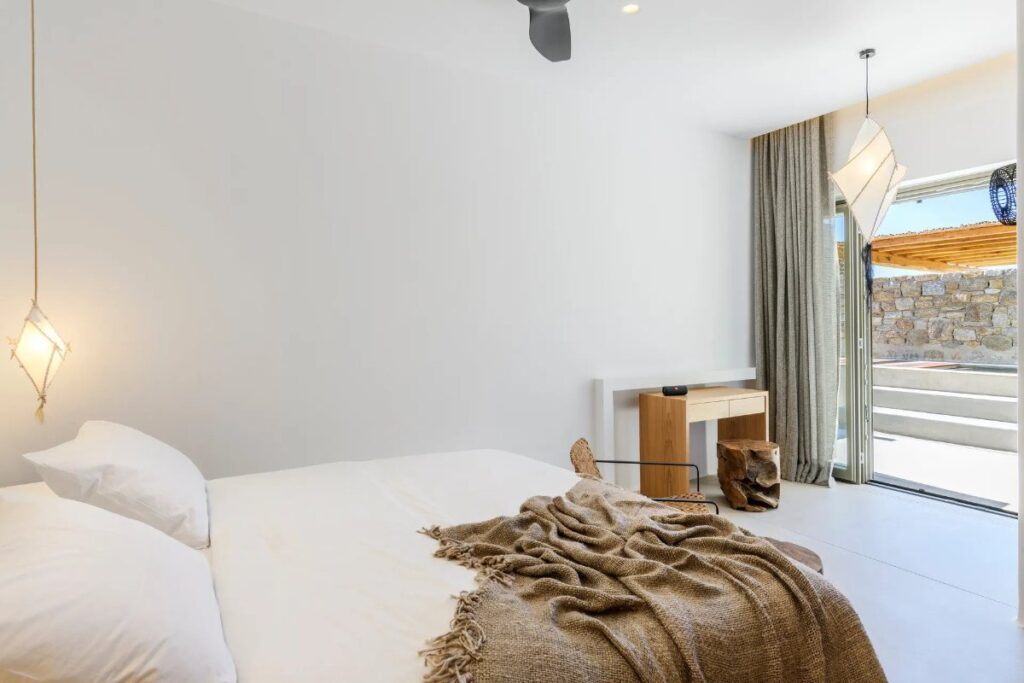 Comfy bed in the bedroom of Mykonos splendid villa for rent.