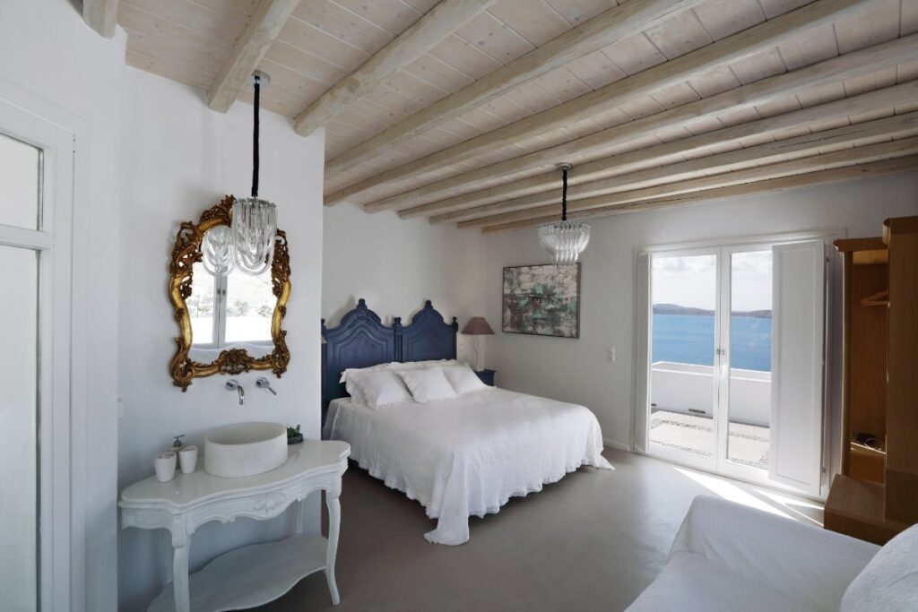 Spacious, full of light, and elegantly decorated bedroom in a luxury villa for booking in Mykonos.