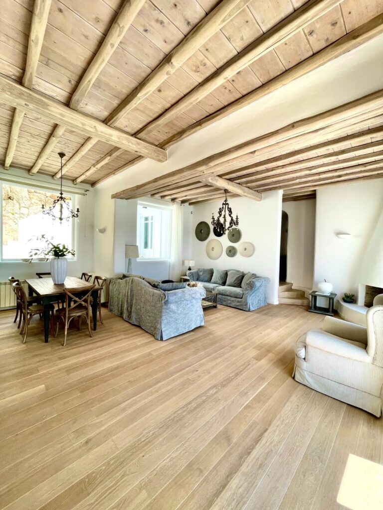 A bright, warm and wooden living room in a luxury villa for rental, Mykonos, Greece.