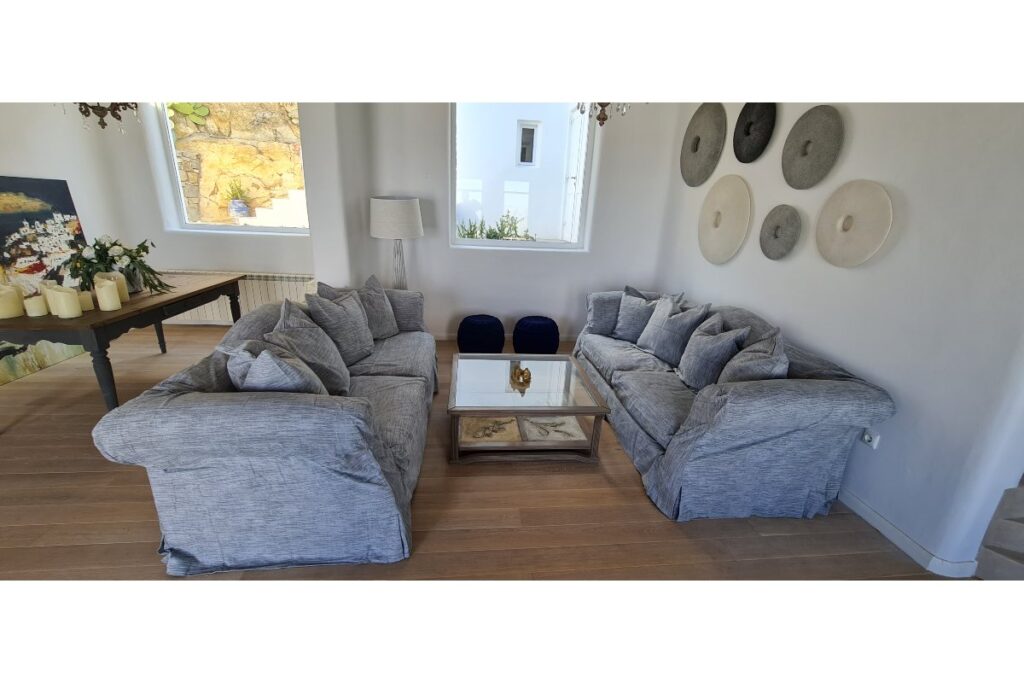 Luxurious living room, with high-quality material and contemporary furnishings, ready for rent in Mykonos.