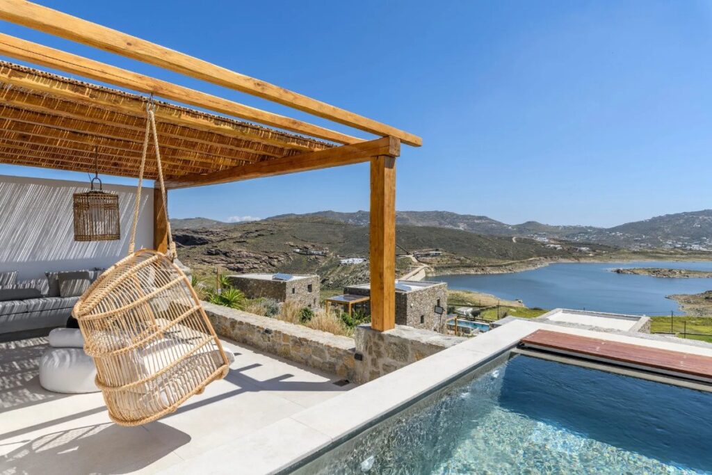 Beautiful garden with a view of the Aegean Sea in Mykonos exceptional villa for rent.
