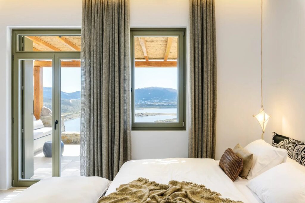Bedroom with access to a terrace, Mykonos rental villa.