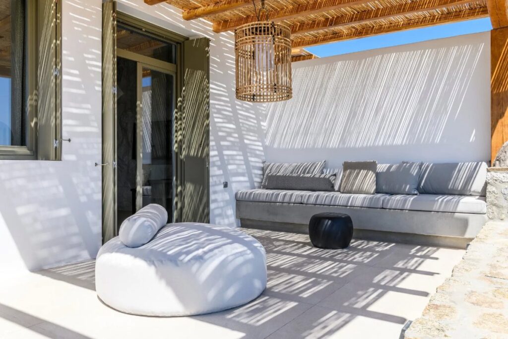 Terrace with sofa and cushion in Mykonos splendid villa for rent.