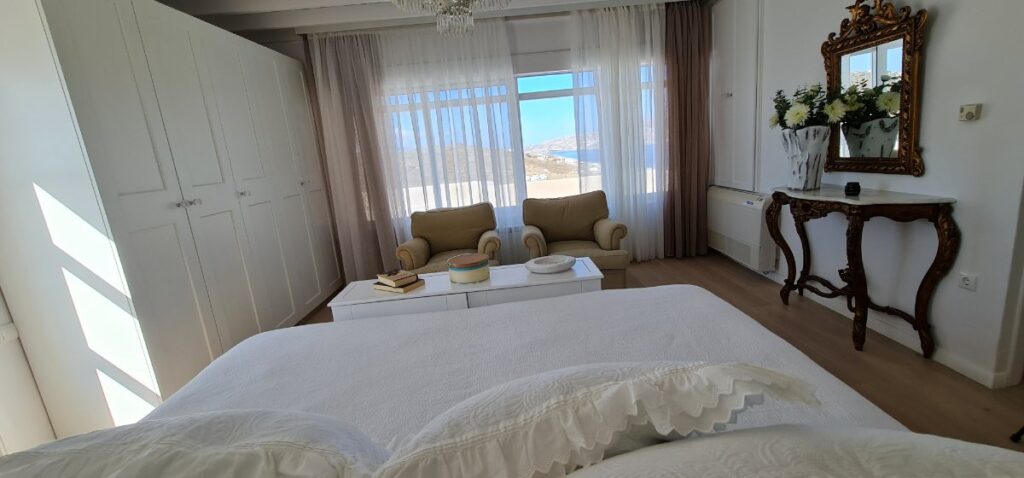 Bedroom with a stunning view from the best villa for rent, Mykonos.