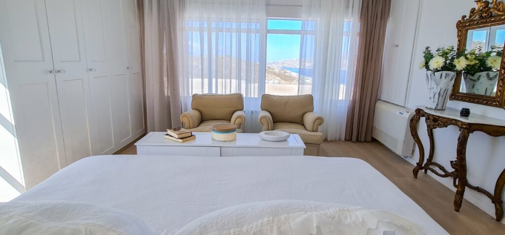 Bedroom with a view of the Aegean Sea, best rental villa, Mykonos.