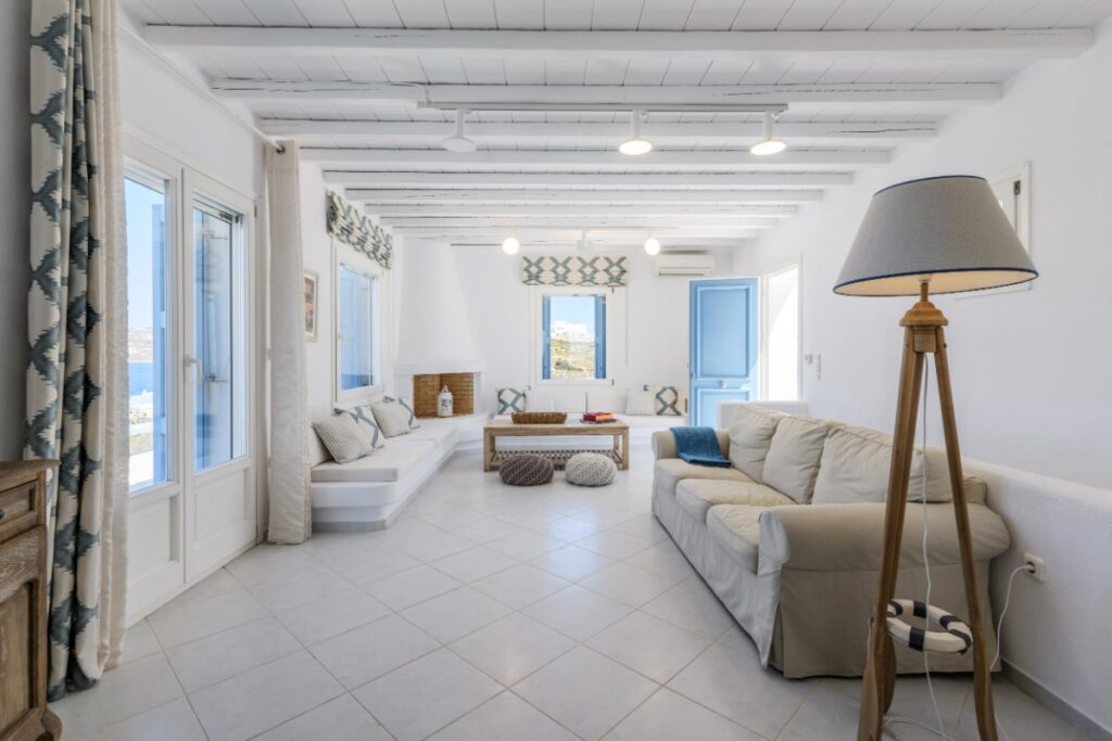 Spacious and cozy living room with a lot of artistic details, Mykonos luxurious villa for rent.