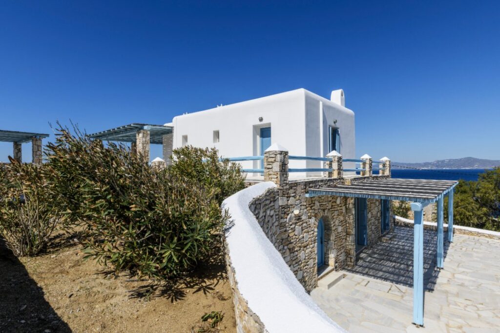 Expansive, cozy yard in a premium villa rental with views of the Aegean sea, Greece.