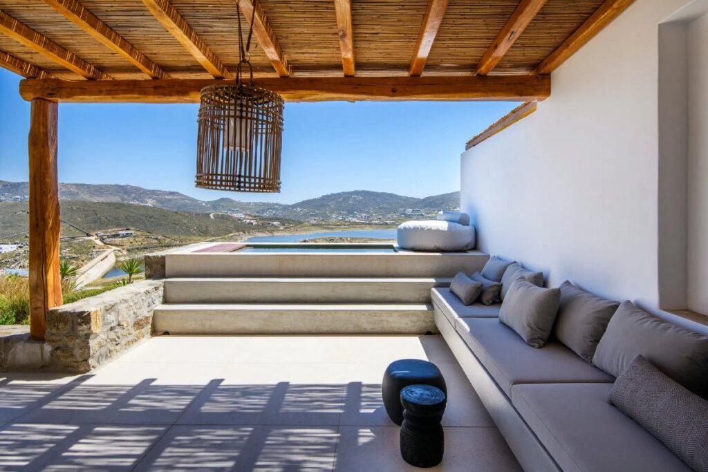Outside furniture and a cute bathtub with a stunning view in Mykonos rental home.