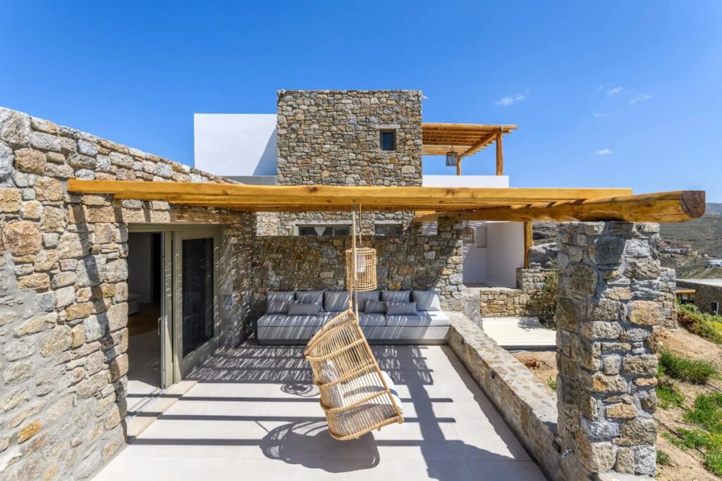 Modern architecture and cozy garden in Mykonos lavish villa for rent.
