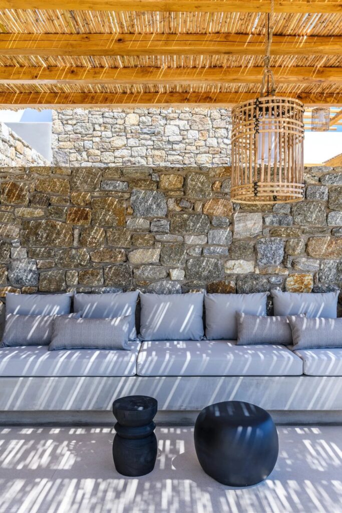 Outside furniture in a luxurious private rental home in Mykonos, Greece.