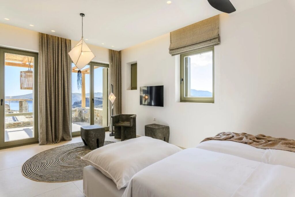Spacious bedroom full of bright in Mykonos best villa for rent.