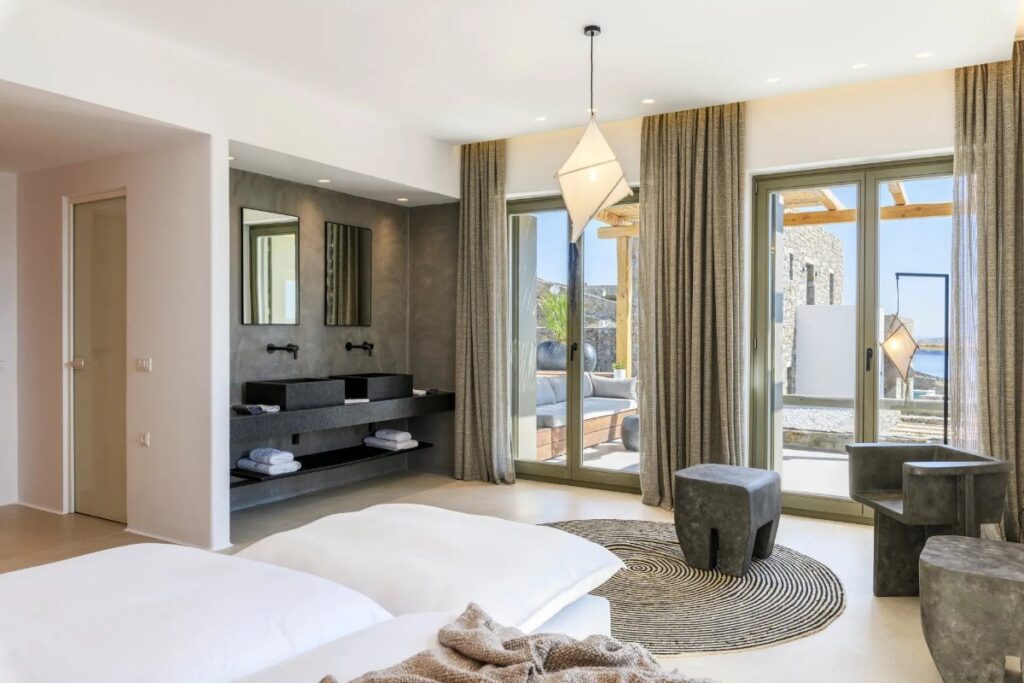 The combination of white, grey, and black colors in a luxurious bedroom, Mykonos top villa for rent.