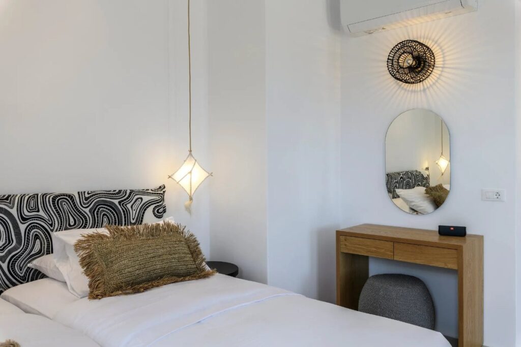 Comfortable bed in luxurious Mykonos villa for rent.